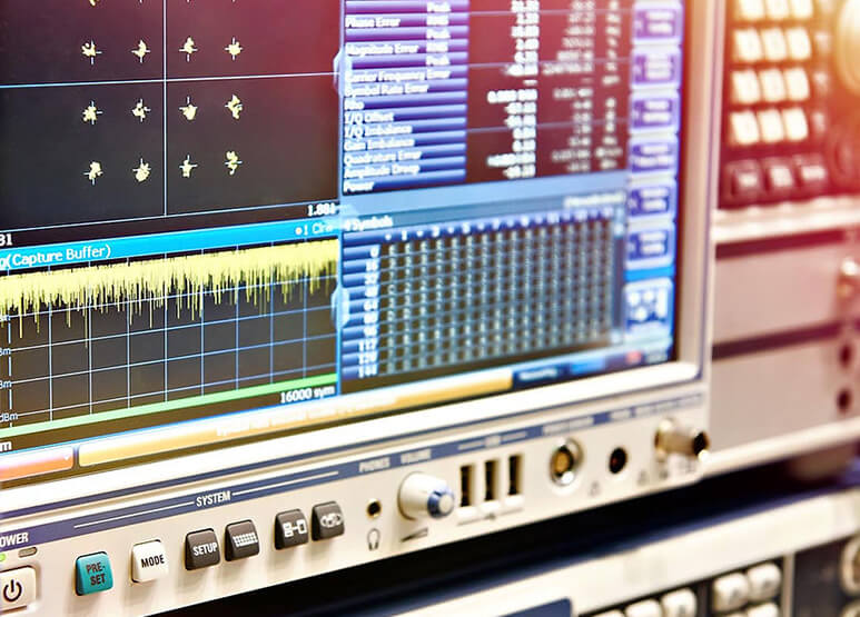 Calibration engineer working with precision test equipment in a laboratory